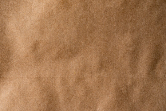 Brown paper texture background with wrinkled kraft surface.