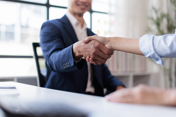 Business handshake for teamwork of business merger and acquisition,successful negotiate,hand shake, businessman shake hand with partner to celebration partnership and business deal concept © Aompix
