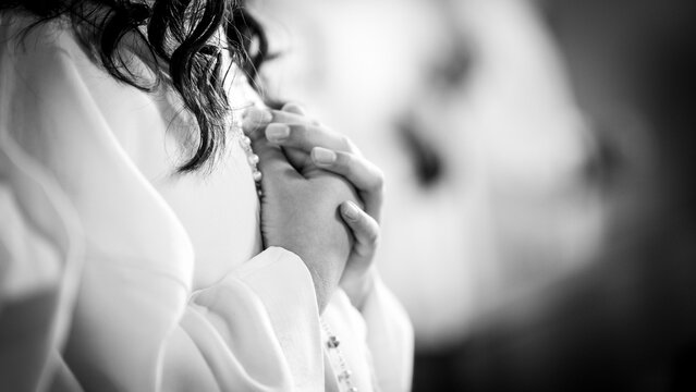 Hands folded together in prayer