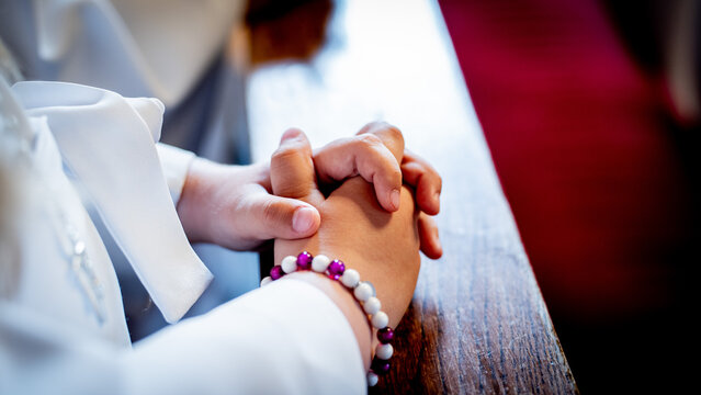 Hands folded together in prayer