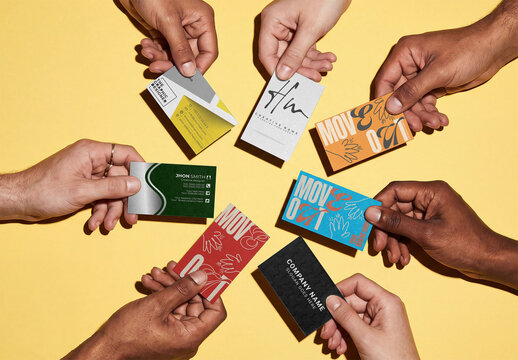 Mockup of seven hands of different races holding seven business cards