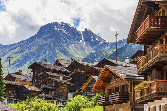Nested old wooden houses, behind the summit of the Scex de Marenda mountain, historic village centre, Grimentz, Val d'Anniviers, Valais Alps, Canton Valais, Switzerland