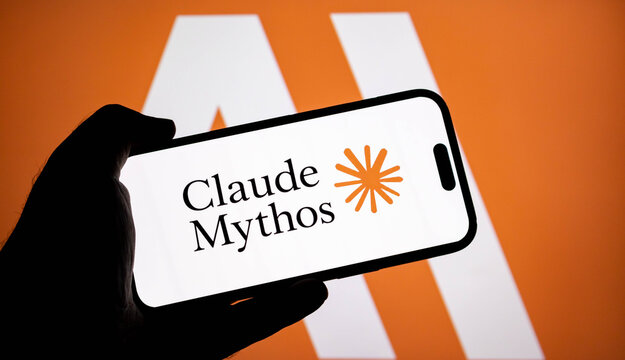 Closeup of a hand holding a smartphone displaying the claude ai logo and the text claude mythos on a screen