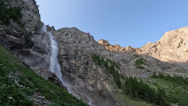Engstligen Waterfall Cascading Down Rocky Alpine Cliff in Adelboden Bernese Oberland Switzerland