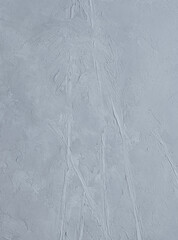 Abstrakcyjne szare tło z wyraźnymi śladami szpachli, minimalistyczna struktura gesso. © Joanna