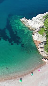 Aerial view of people swimming at the famous Milocer beach in Montenegro