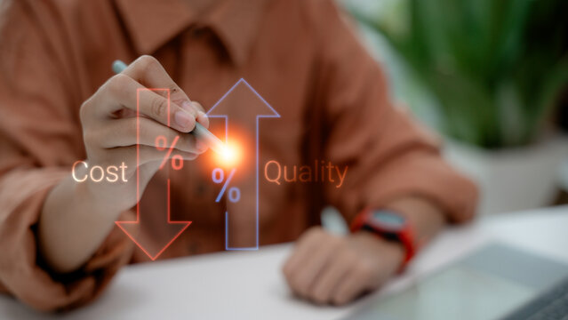 Close-up of a businesswoman holding a stylus pen pointing at virtual graphics showing cost reduction arrow down and quality improvement arrow up for business optimization strategy concept.