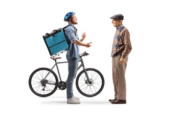 Naklejka premium Food delivery courier with a bicycle talking to an elderly man