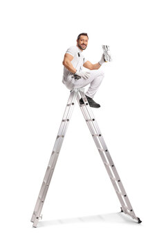 Worker sitting on a ladder and holding a throwel