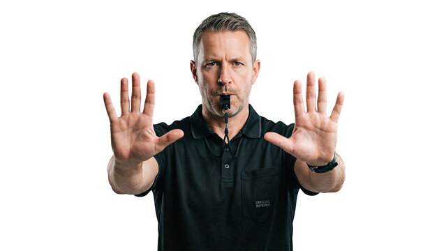 White male referee blowing whistle and showing stop sign with both hands. Middle aged adult man in official uniform looking at camera on transparent background. Concept of sports rule, authority, and 