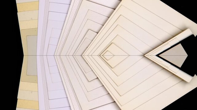 A vibrant collection of colored mat board samples arranged in nested geometric layers