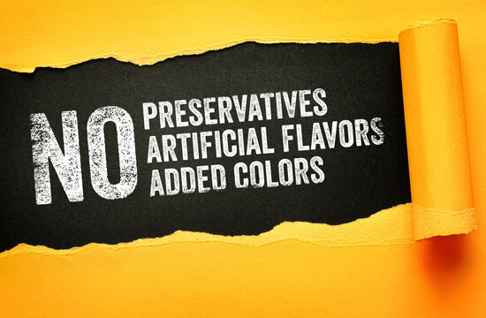 NO preservatives, artificial flavors, or added colors highlighted in bold torn paper design. Conceptual typography for organic, clean-label, and healthy food marketing visuals