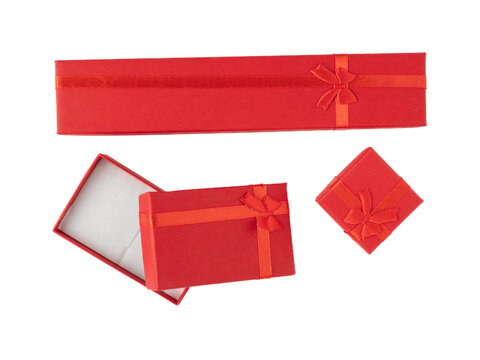red cardboard jewelry boxes with ribbon bows   flat lay