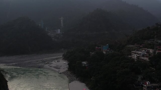 Drone View of Rishikesh City and Ganga River Showing Himalayan Landscape, Spiritual Ghats, Bridges, and Scenic Uttarakhand Travel Destination