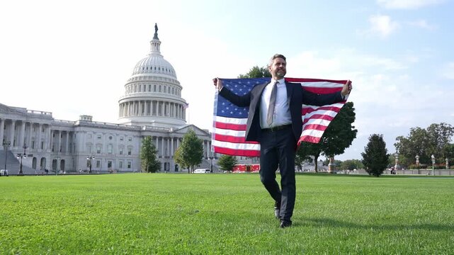 Leadership and success. Successful political leader. Businessman at US Capitol. Business man in Washington DC. Man with American flag. Politician on independence day. Successful career in USA