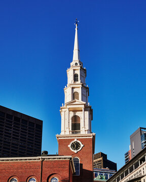 Park Street Church, built in 1806, featuring a prominent white steeple with a large clock face, Boston, Massachusetts, New England