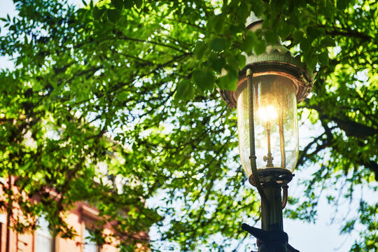 vintage, ornate iron street lamp, characteristic of historic city lighting in the Charlestown neighborhood of Boston, Massachusetts, New England