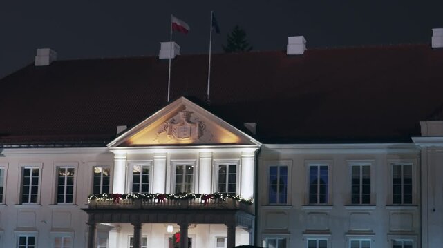 Potocki Palace Illuminated at Night with Waving Polish Flag in Warsaw