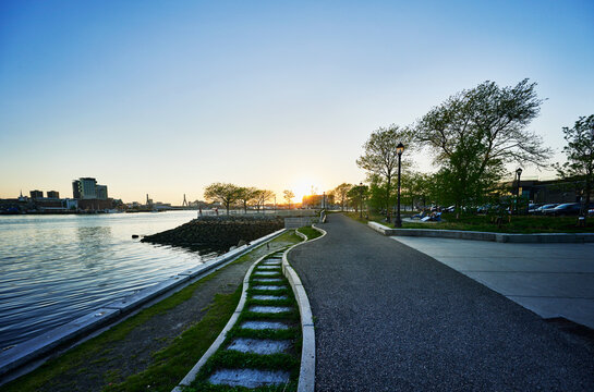 Walking path through LoPresti Park at sunset, a four-acre waterfront location in Boston, Massachusetts, New England, United States 
