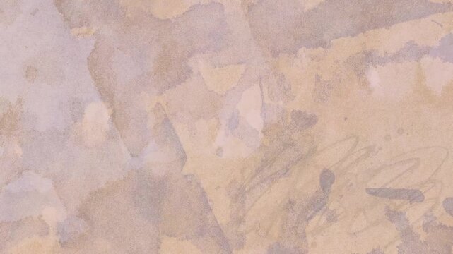 Abstract beige background with paper texture with uneven watercolor spots in a chaotic arrangement , looping animation.