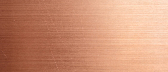 Fototapeta premium Brushed bronze metal surface with fine horizontal lines and subtle scratches