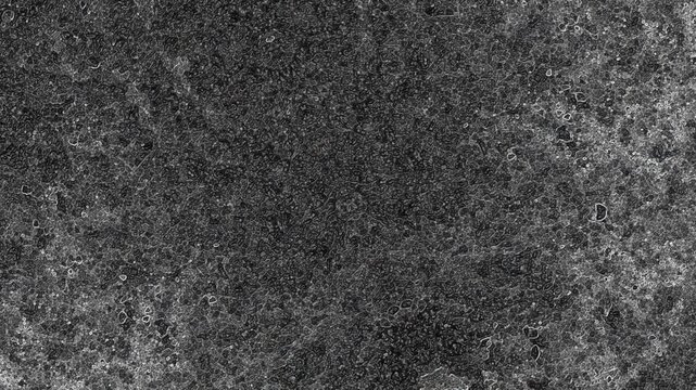 Dark mottled texture with fine porous details, subtle gradients, and weathered mineral appearance. Grunge texture background animation.