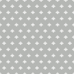 Minimal gray seamless pattern with elegant white fleur de lis motifs, classic decorative wallpaper background perfect for textiles, packaging and interior decor. © MedReda