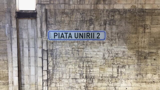Piata Unirii 2 Metro Station Sign on Textured Wall in Bucharest