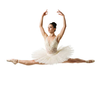 Ballerina in white tutu performing grand jete jump against isolated background representing athletic grace, classical form and elegance.