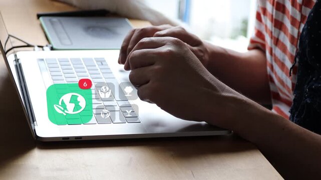 Typing on laptop, an Asian man researches green conservation at home, with a 3D tracked eco planet leaf badge and recycling tree notification symbols.