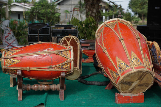 Traditional Indonesian kendang drum with an ornate carved wooden body, representing gamelan music, Javanese culture, and cultural heritage