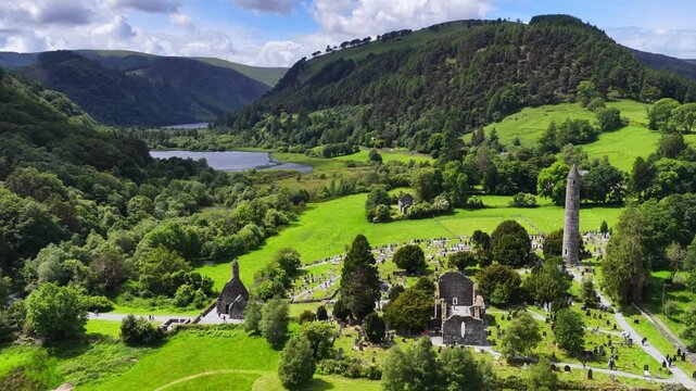 Glendalough valley in Wicklow national park in Ireland, aerial view, drone shot of Round Tower and Saint Kevin's church in Glendalough medieval village, Irish nature, travel in Ireland