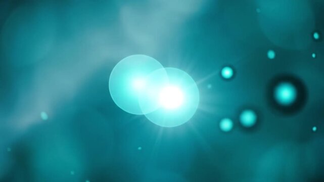 Teal water bubbles with bright blue bokeh.