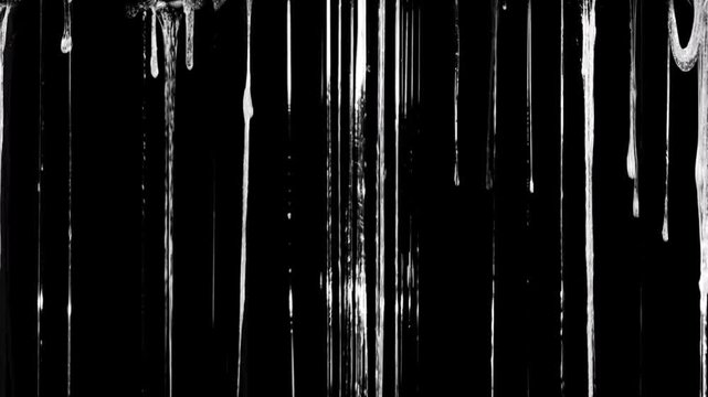 The liquid forms textured lines, some of which appear stretchy and sticky at the top (resembling a spiderweb or slime), creating a sharp contrast against the solid black background.