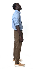 Fototapeta premium side view of a man standing looking up on white background