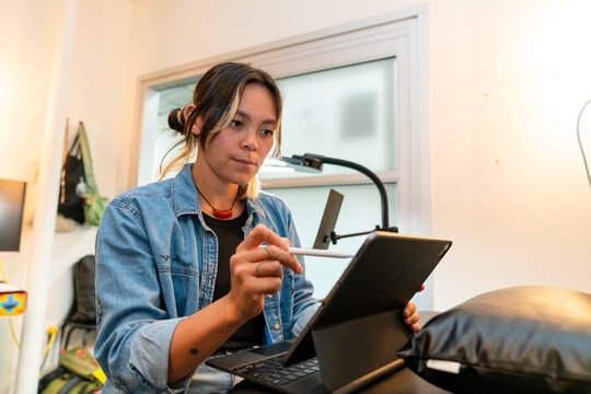 casual worker using stylus pen and tablet