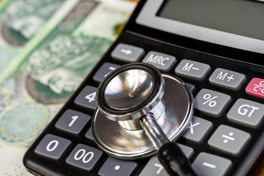 Stethoscope, calculator - health care costs concept
