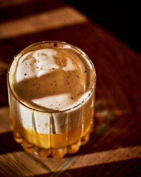 Close-Up of Creamy Espresso Cocktail in Moody Bar Lighting. 