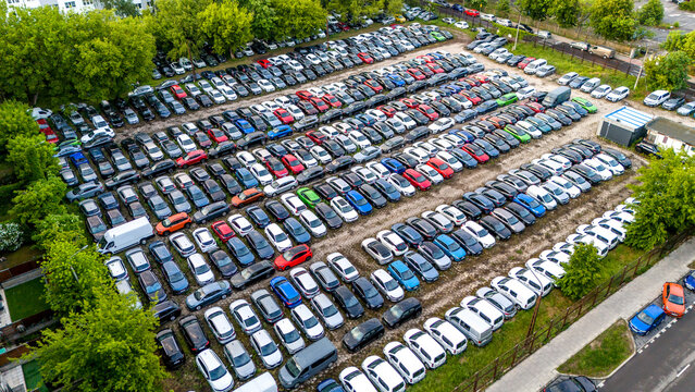Aerial photo of many modern cars stored on a parking lot