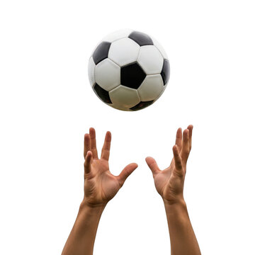 Hands reaching up to catch a white soccer ball in mid-air isolated on transparent background