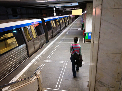 Person walking along metro platform in Bucharest