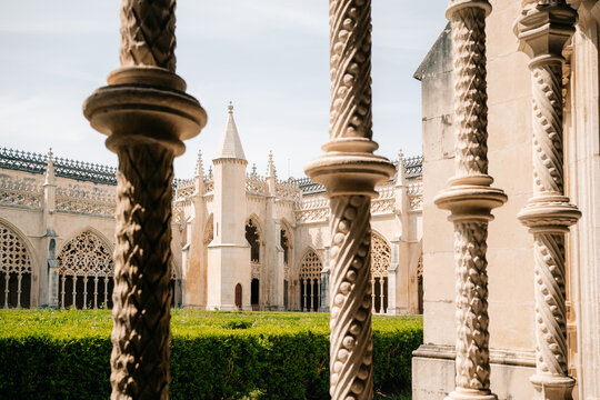 View of Castle Courtyard Through Stone Columns in Daylight