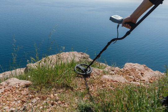 Man with metal detector exploring the surroundings