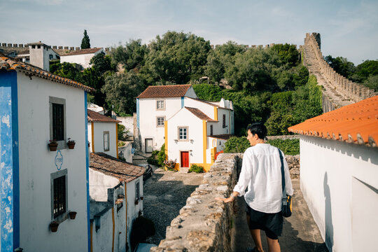 Exploring a Hilltop Village in Portugal During a Sunny Day