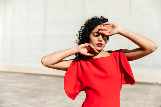 Woman shielding face from sunlight 