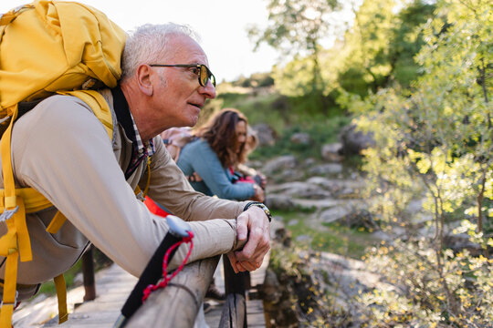 Senior man exploring nature during an active hiking trip