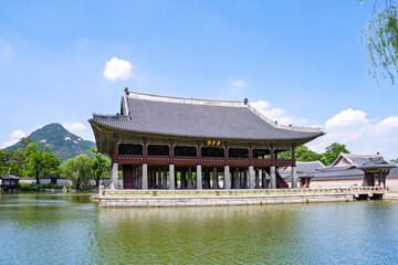 Fototapeta premium Gyeongbokgung Palace Gyeonghoeru Pavilion with Bugaksan Mountain and Pond in Seoul Korea