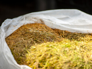 hay in a plastic bag © vectorass