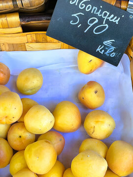 Golden yellow plums gathered in a small cluster