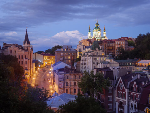 Suburb of Kyiv at dusk with historic church. 